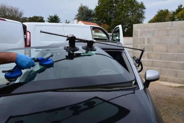 Service Pros Auto Glass technician repairing a windshield